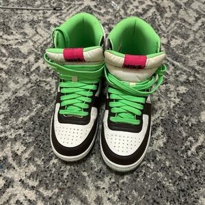 Green and pink Nike high tops